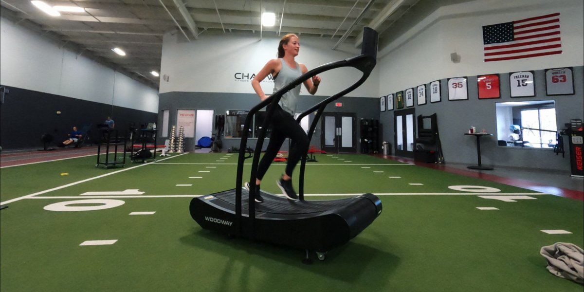 Erin Running on Curve-min self propelled treadmill
